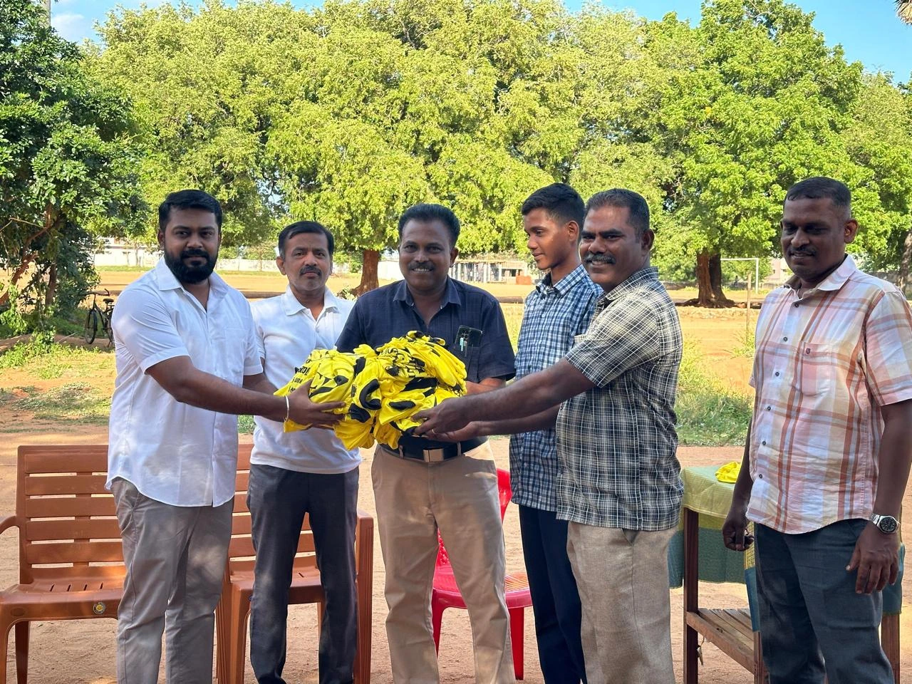 T.R. Krishnaraja and DMK Youth Wing organizers distributing sports kits to students at Tenkasi ICI Government Boys Higher Secondary School